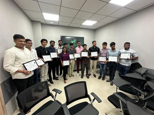A batch of students holding their SMT completion certificates